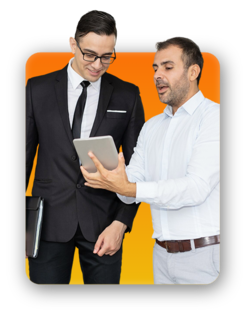 Two colleagues looking at a laptop