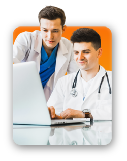 Two colleagues looking at a laptop