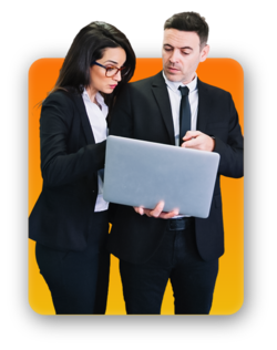 Two colleagues looking at a laptop
